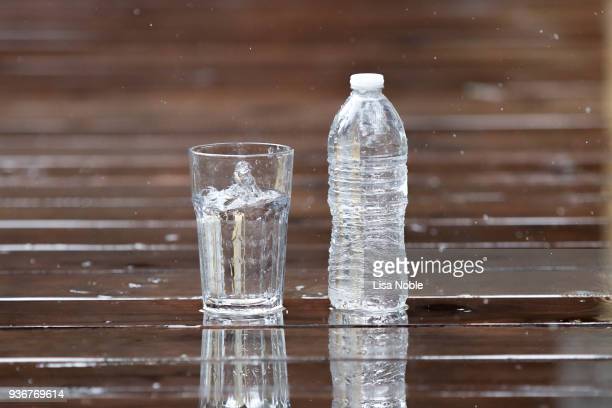 Plastic Bottle Of Drink Water And Reflection On Table With
